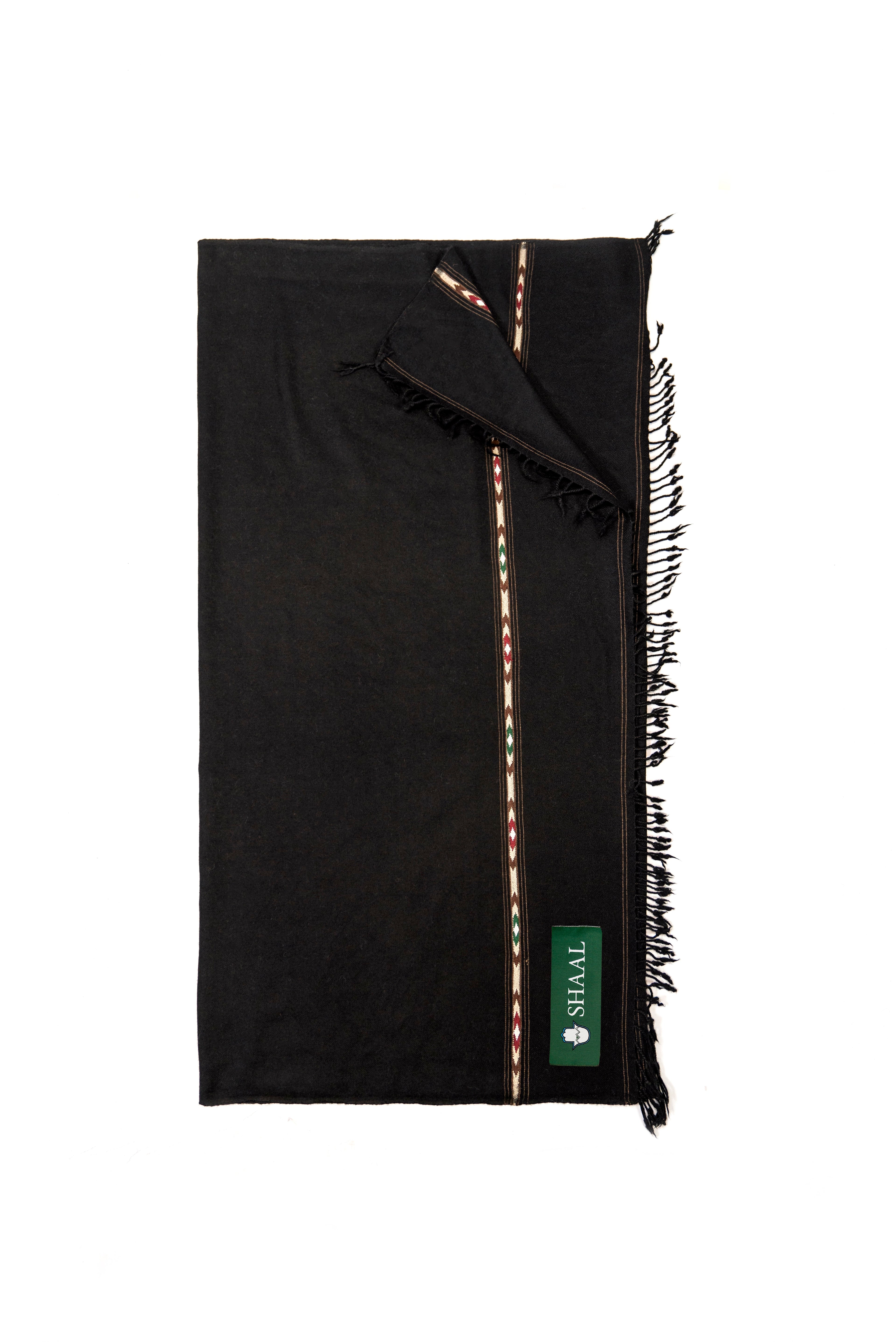 Black lambs wool wrap with fringes and a green label on a white background