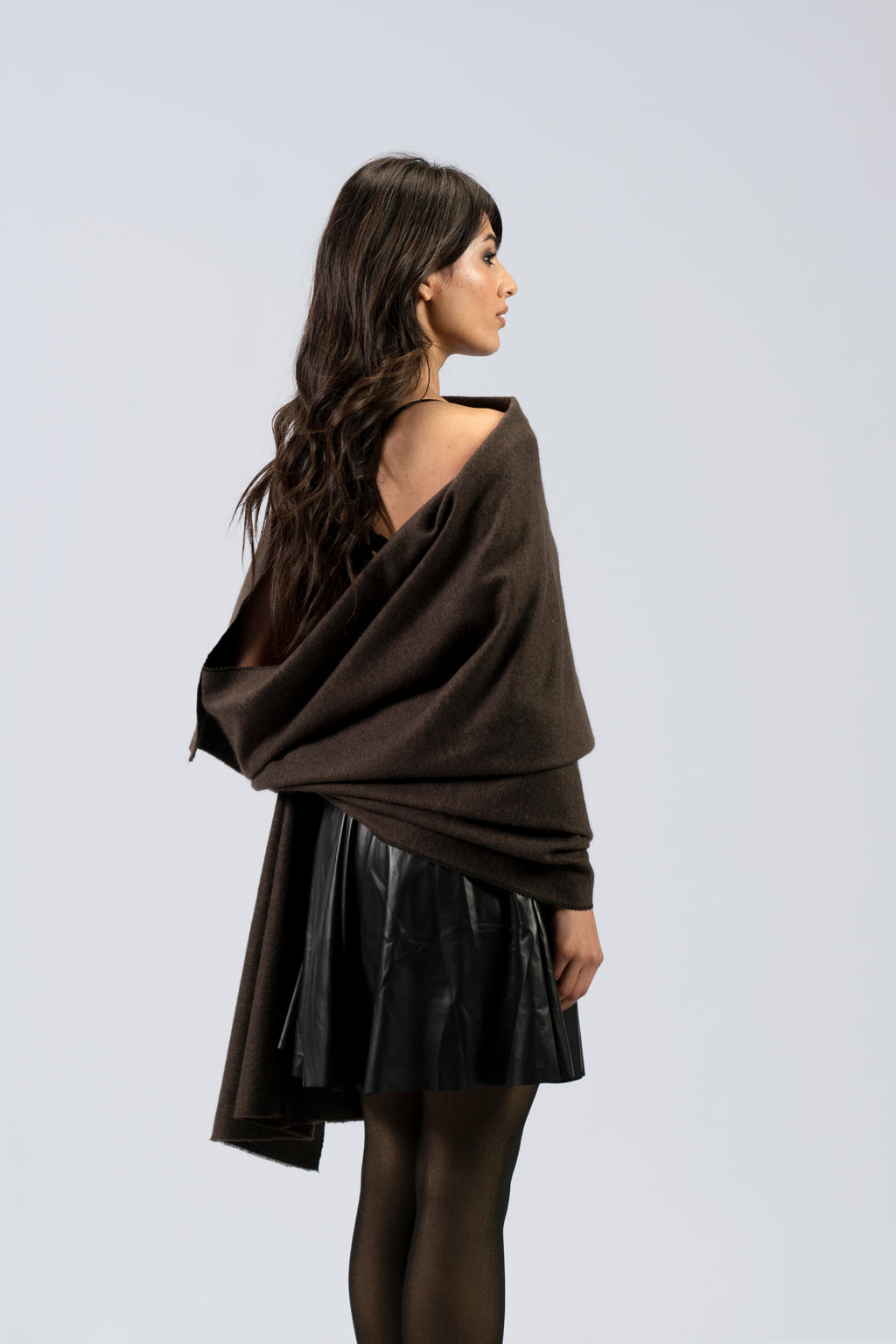 Brown handwoven wool shawl worn by model, back view
