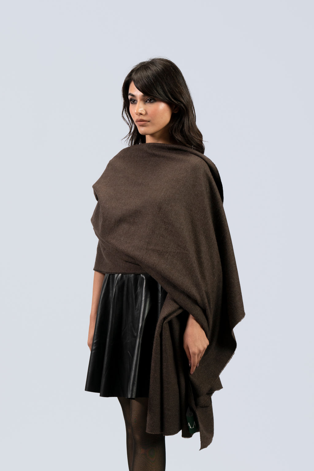Brown handwoven wool shawl worn by model, side view