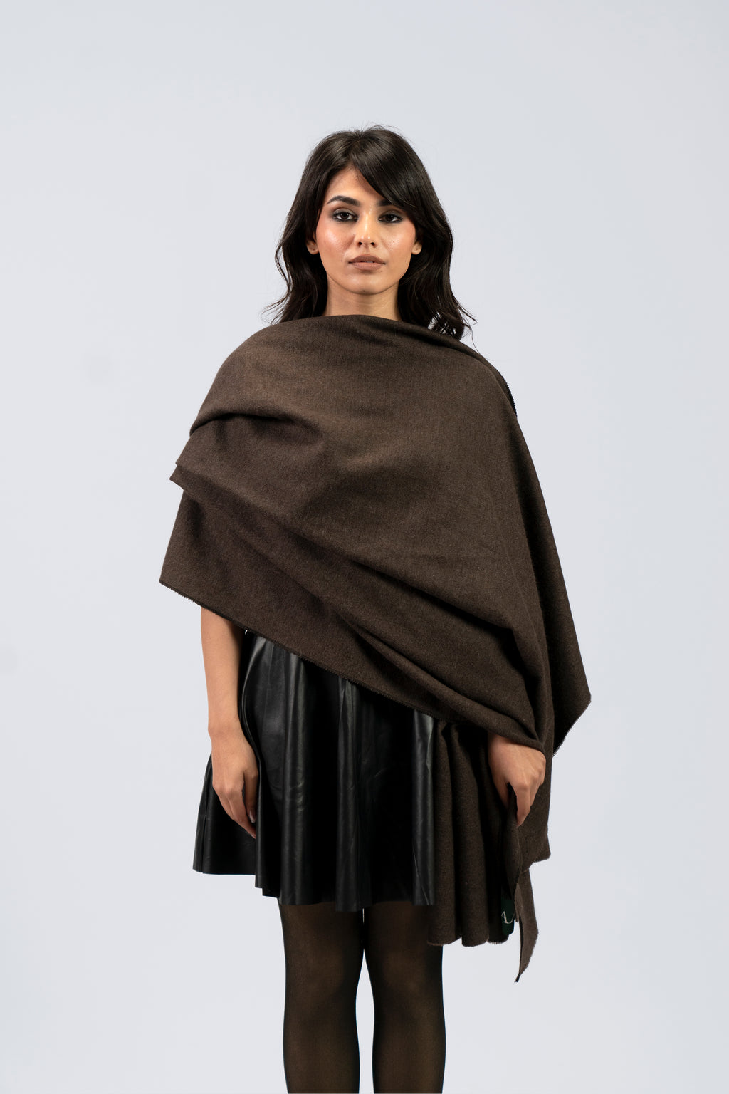 Brown handwoven wool shawl draped over model, front view