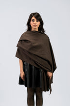 Brown handwoven wool shawl draped over model, front view