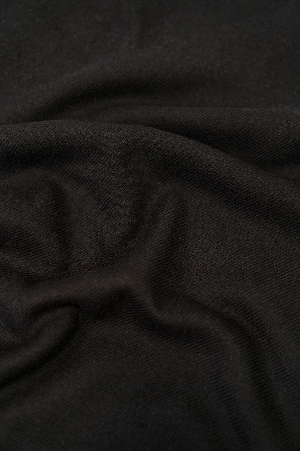 Black midweight wool shawl close-up of khadi weave fabric texture