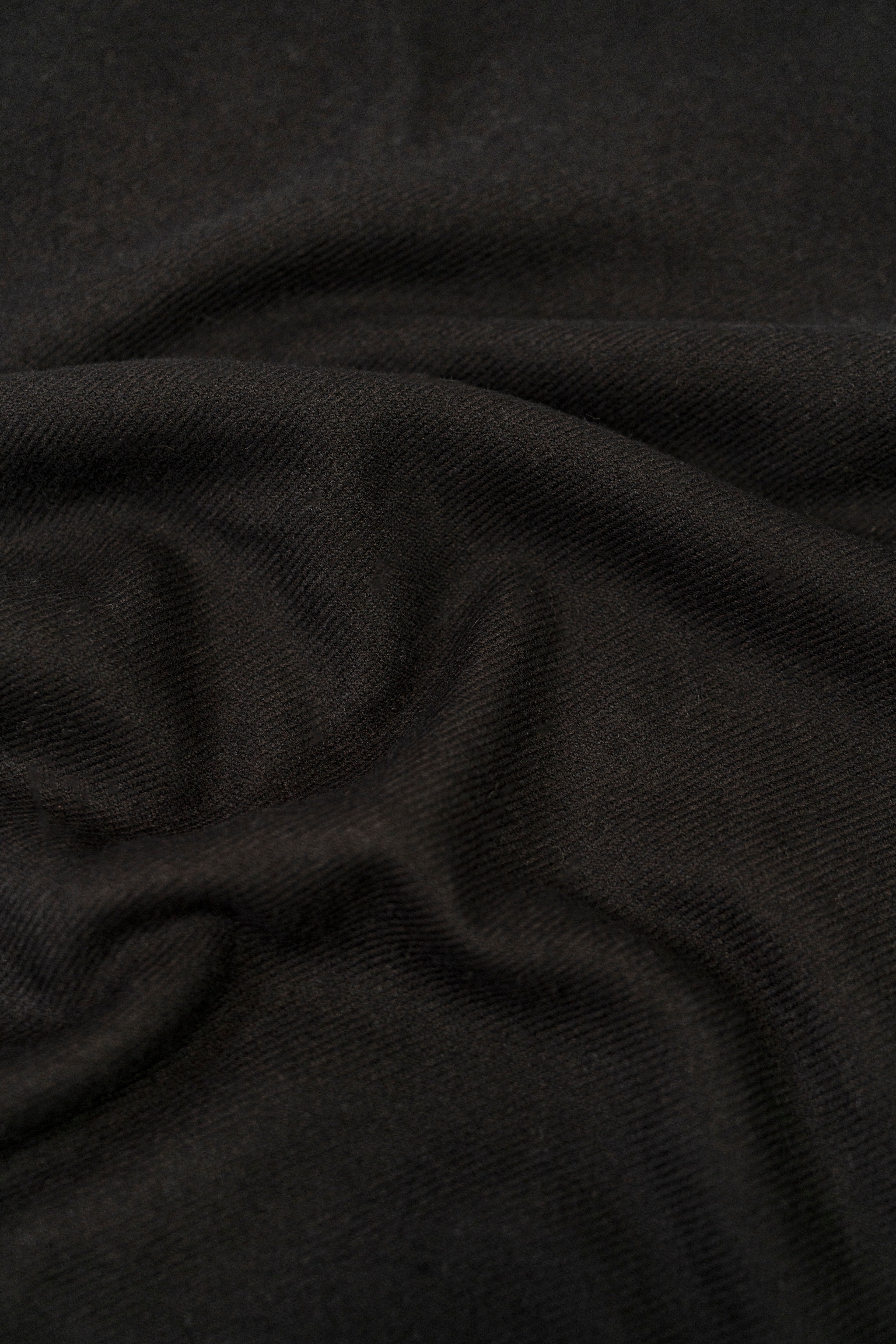 Black midweight wool shawl close-up of khadi weave fabric texture
