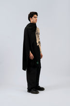 Black midweight wool shawl from behind on male model in printed top, three-quarter back view
