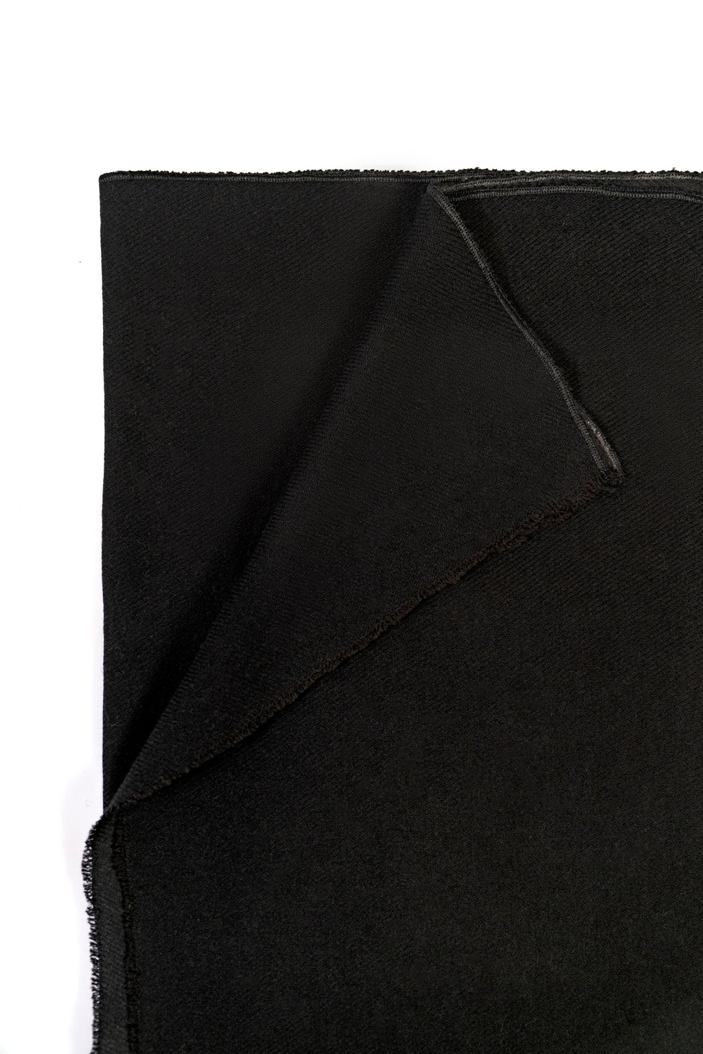 Black midweight wool shawl folded corner on white background