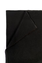 Black midweight wool shawl folded corner on white background