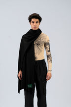 Black midweight wool shawl draped over one shoulder on male model in printed top, front view