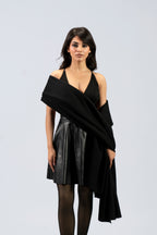 Black midweight wool shawl draped across torso on female model, front view