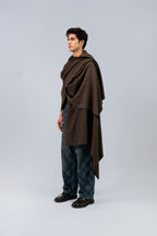Brown handwoven wool shawl worn by model, side view