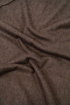 Brown handwoven wool shawl fabric texture detail