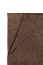 Brown handwoven wool shawl folded flat, fabric detail