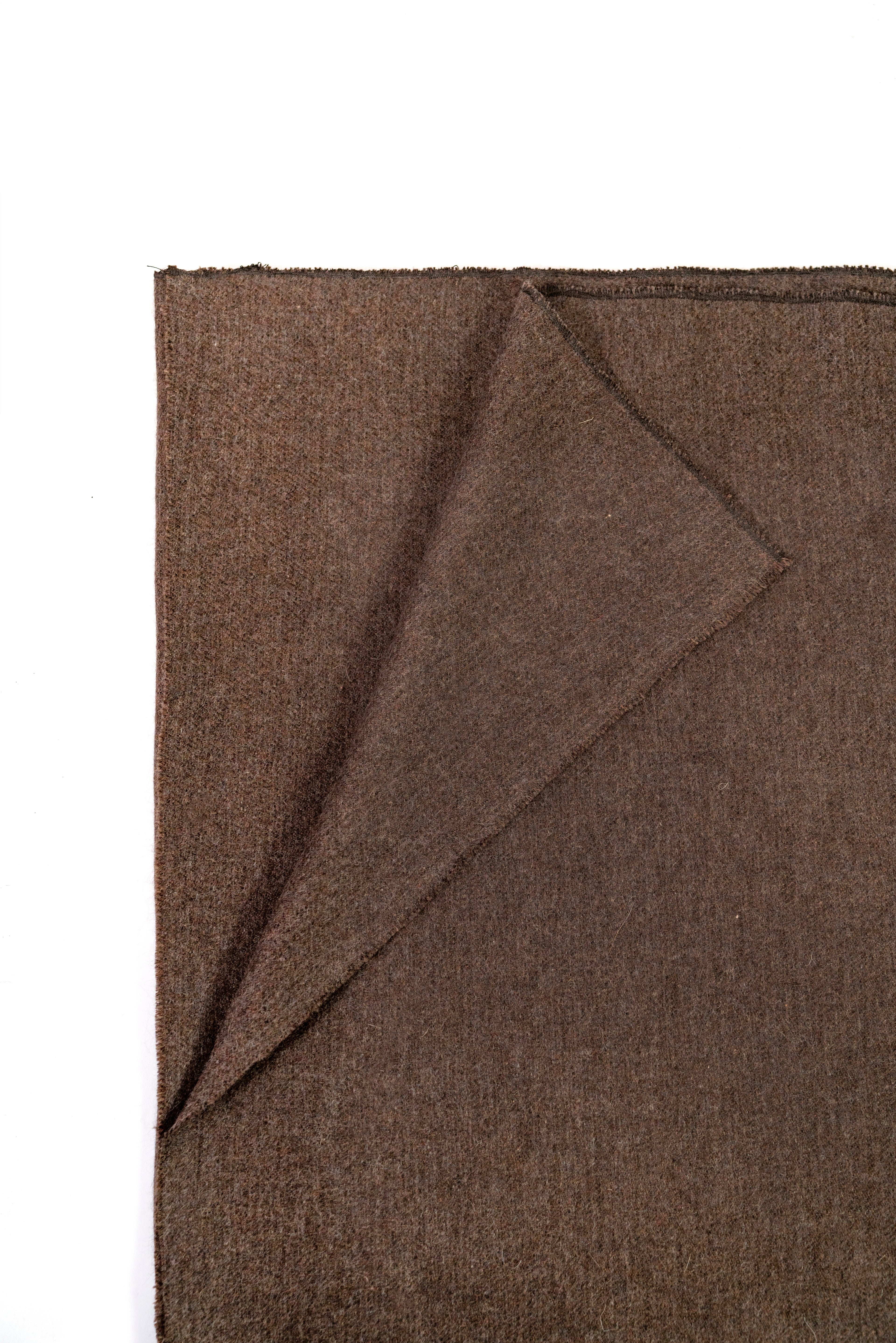 Brown handwoven wool shawl folded flat, fabric detail