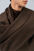 Brown handwoven midweight wool shawl, worn