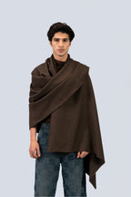 Brown handwoven wool shawl draped over model, front view