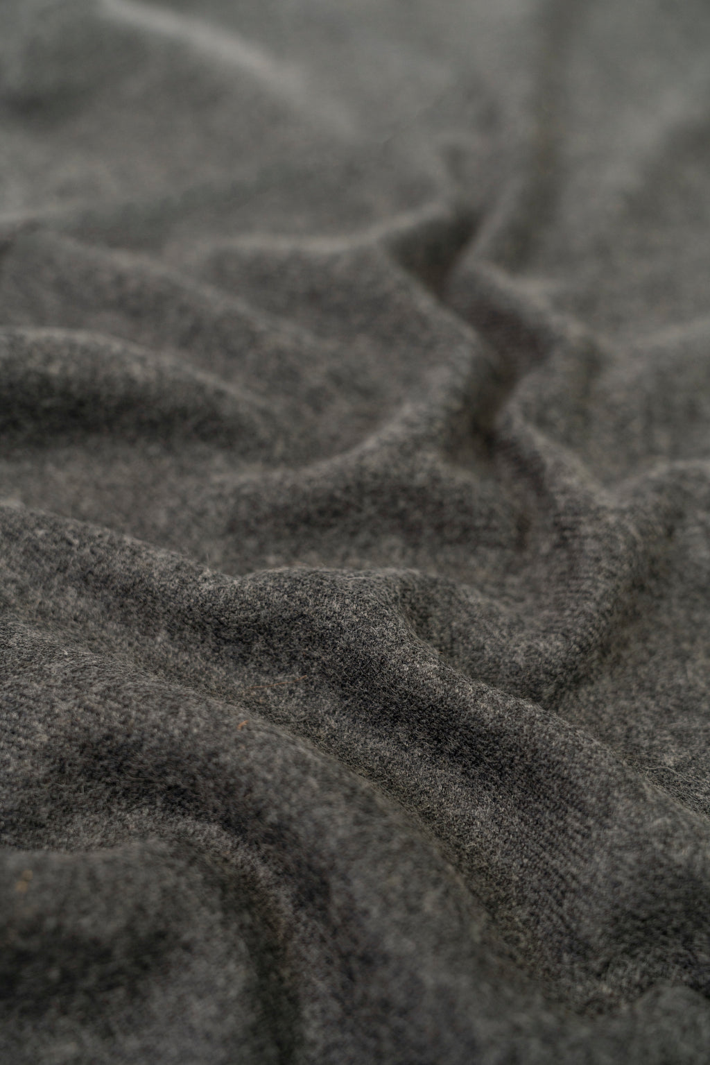 Gray handwoven wool shawl fabric texture detail