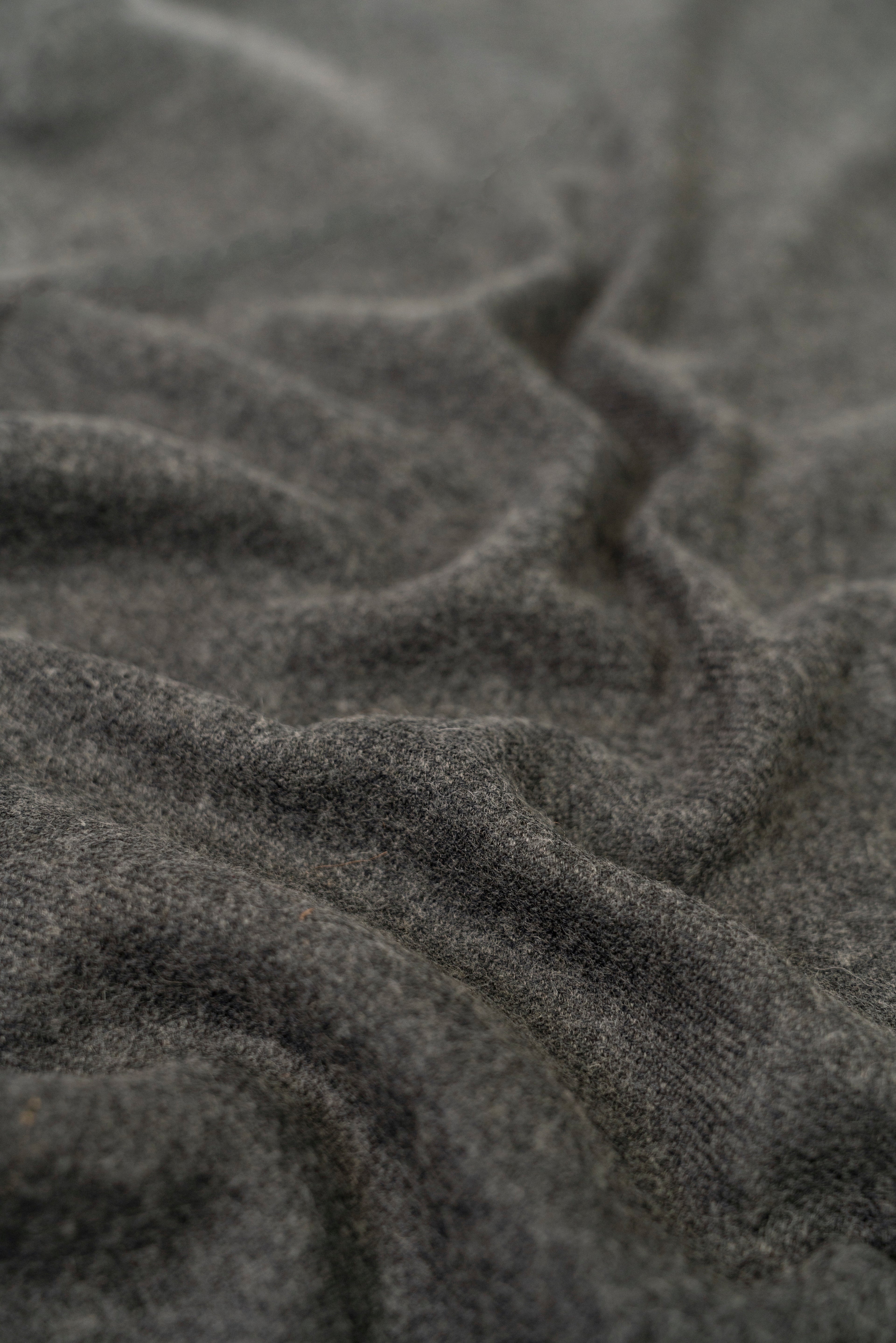 Gray handwoven wool shawl fabric texture detail
