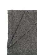 Gray handwoven wool shawl folded flat, fabric detail
