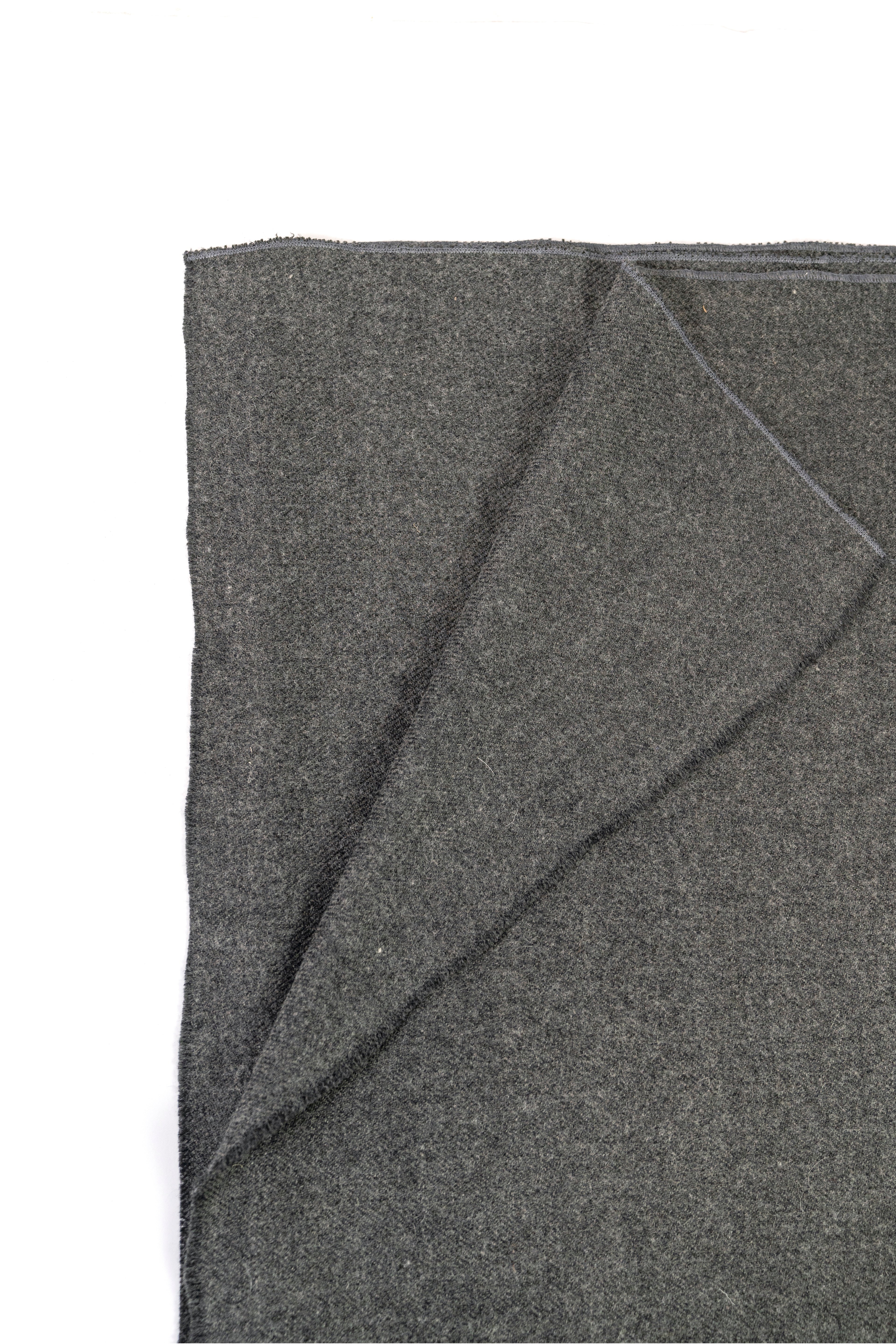 Gray handwoven wool shawl folded flat, fabric detail