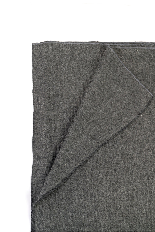Gray handwoven wool shawl folded flat, fabric detail