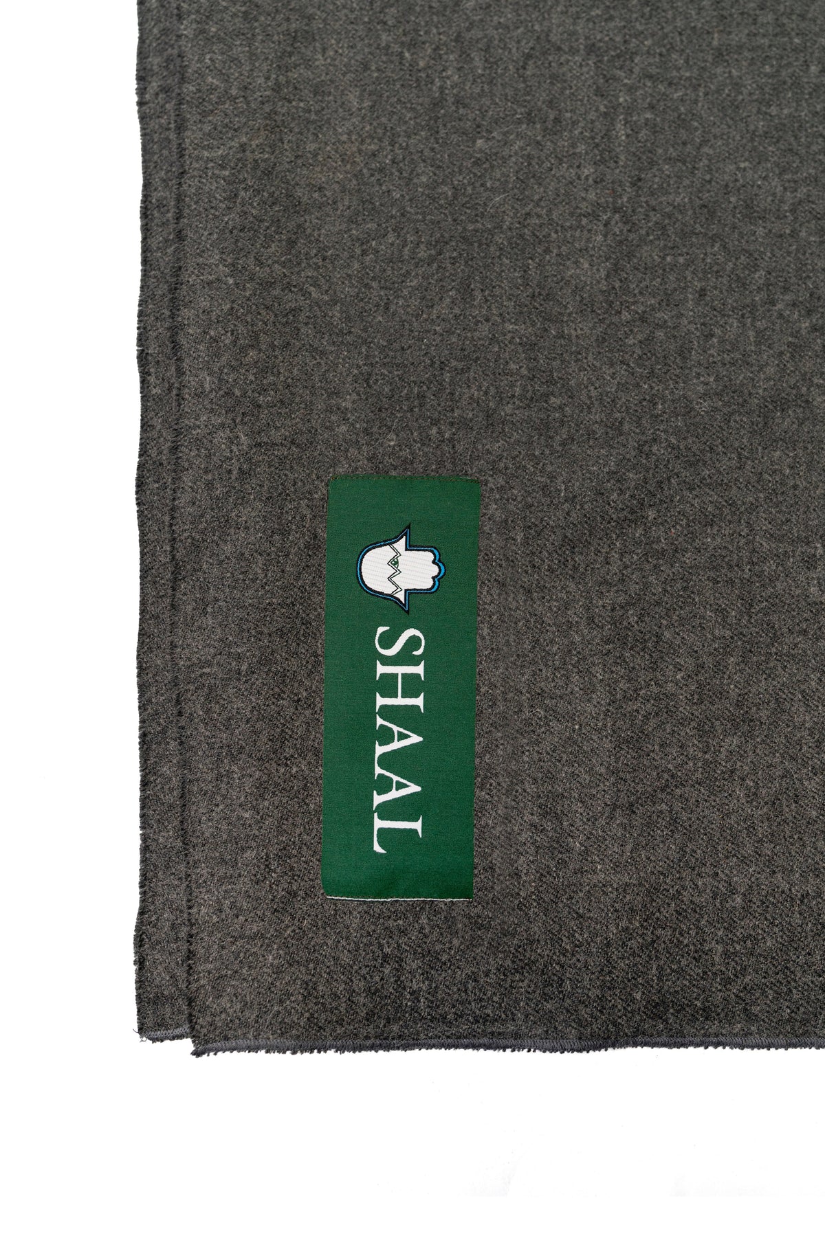 Grey handwoven midweight wool shawl, label detail