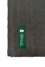 Gray handwoven wool shawl with SHAAL label detail