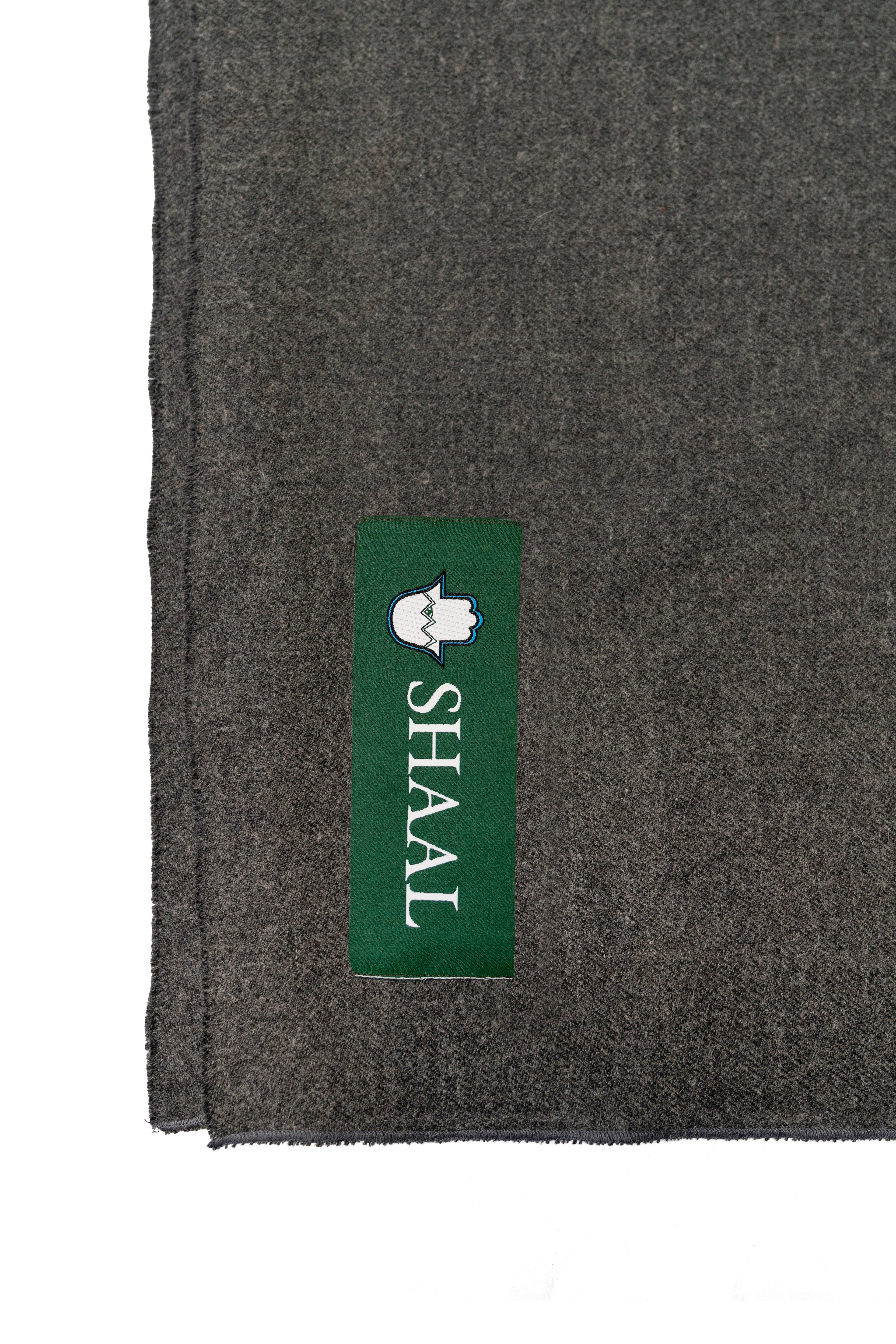 Gray handwoven wool shawl with SHAAL label detail