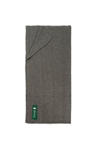 Gray handwoven wool shawl folded flat with SHAAL label