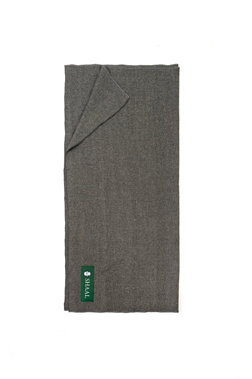 Gray handwoven wool shawl folded flat with SHAAL label