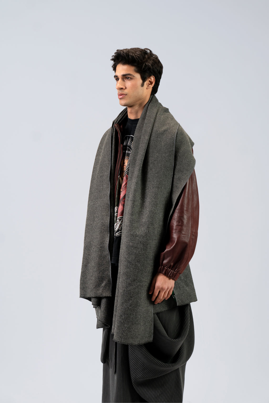 Gray handwoven wool shawl worn by model, side view