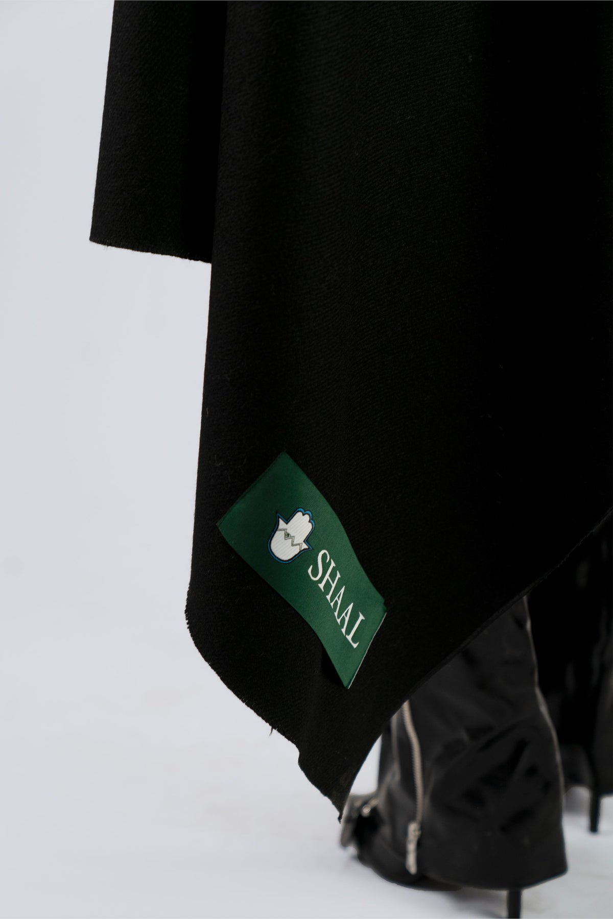 Black handwoven heavyweight wool shawl, worn