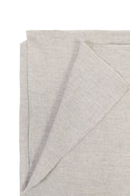 silver handwoven wool shawl worn by a woman, handwoven by SHAAL