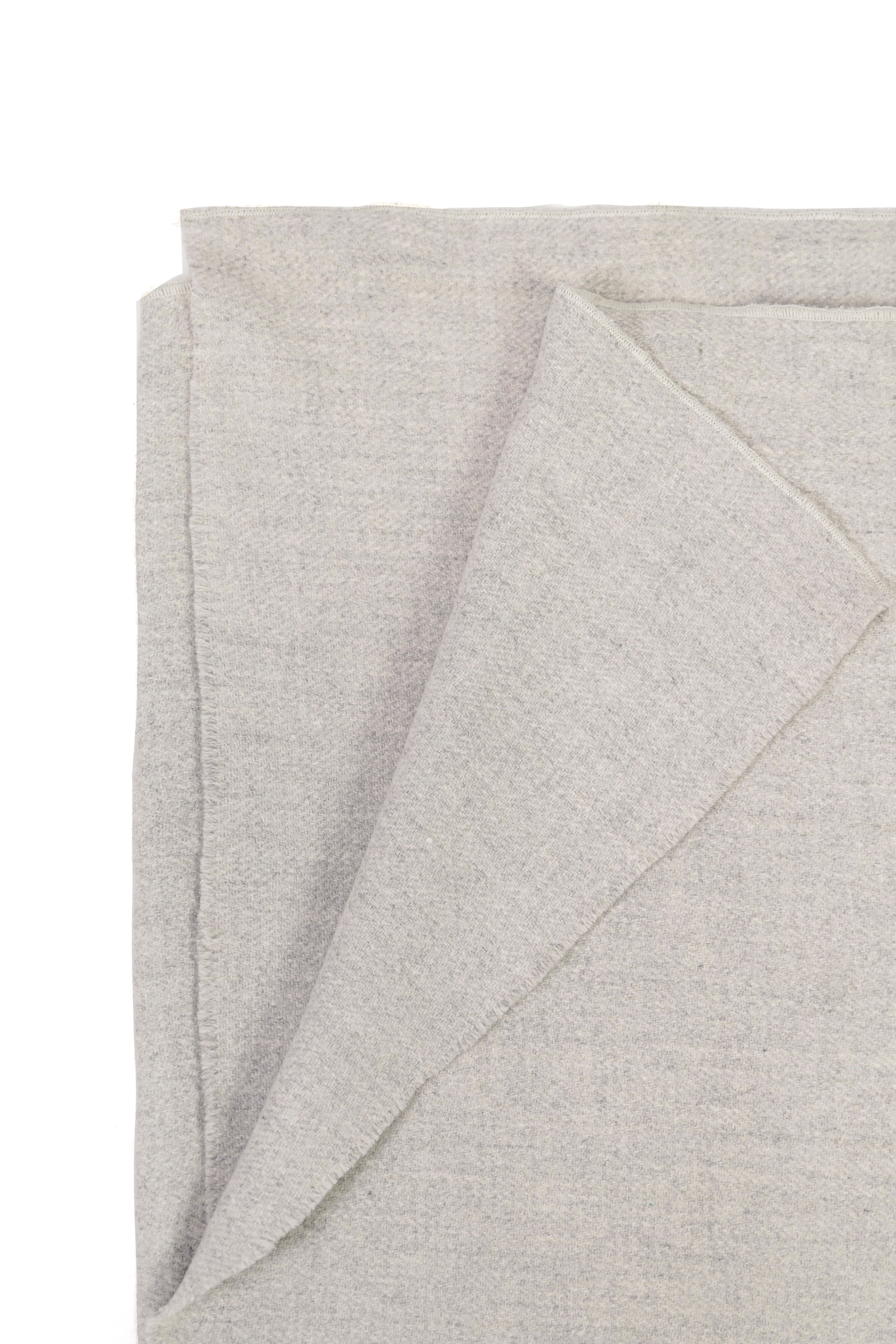 silver handwoven wool shawl worn by a woman, handwoven by SHAAL