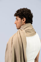 beige handwoven wool shawl worn by a woman, handwoven by SHAAL