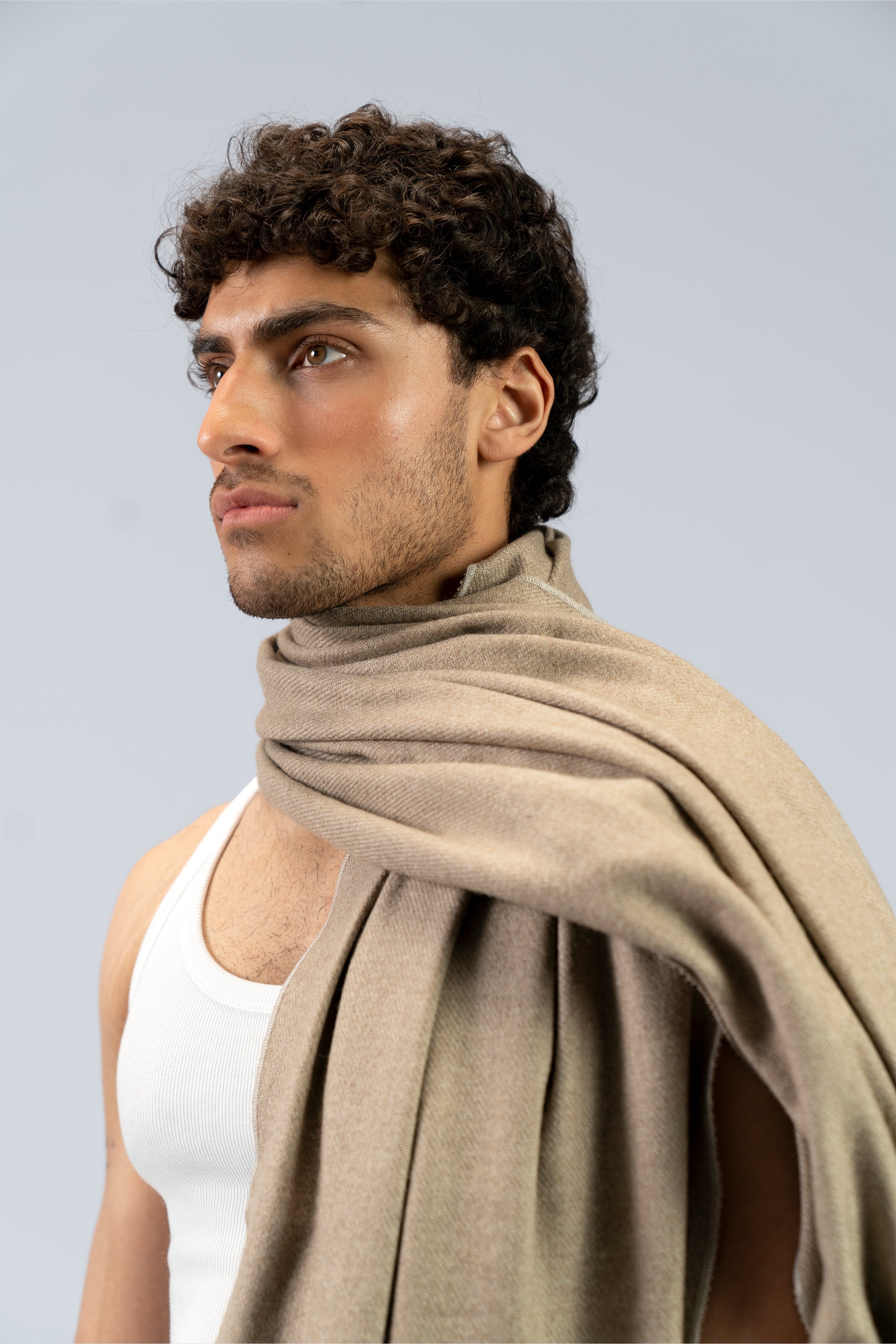 beige handwoven wool shawl worn by a woman, handwoven by SHAAL