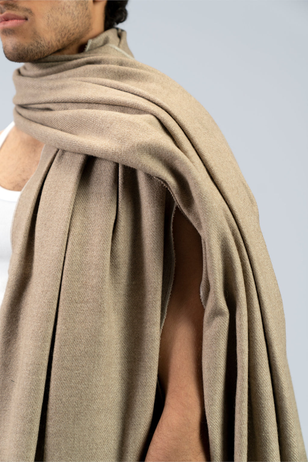 beige handwoven wool shawl worn by a woman, handwoven by SHAAL