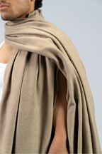 beige handwoven wool shawl worn by a woman, handwoven by SHAAL
