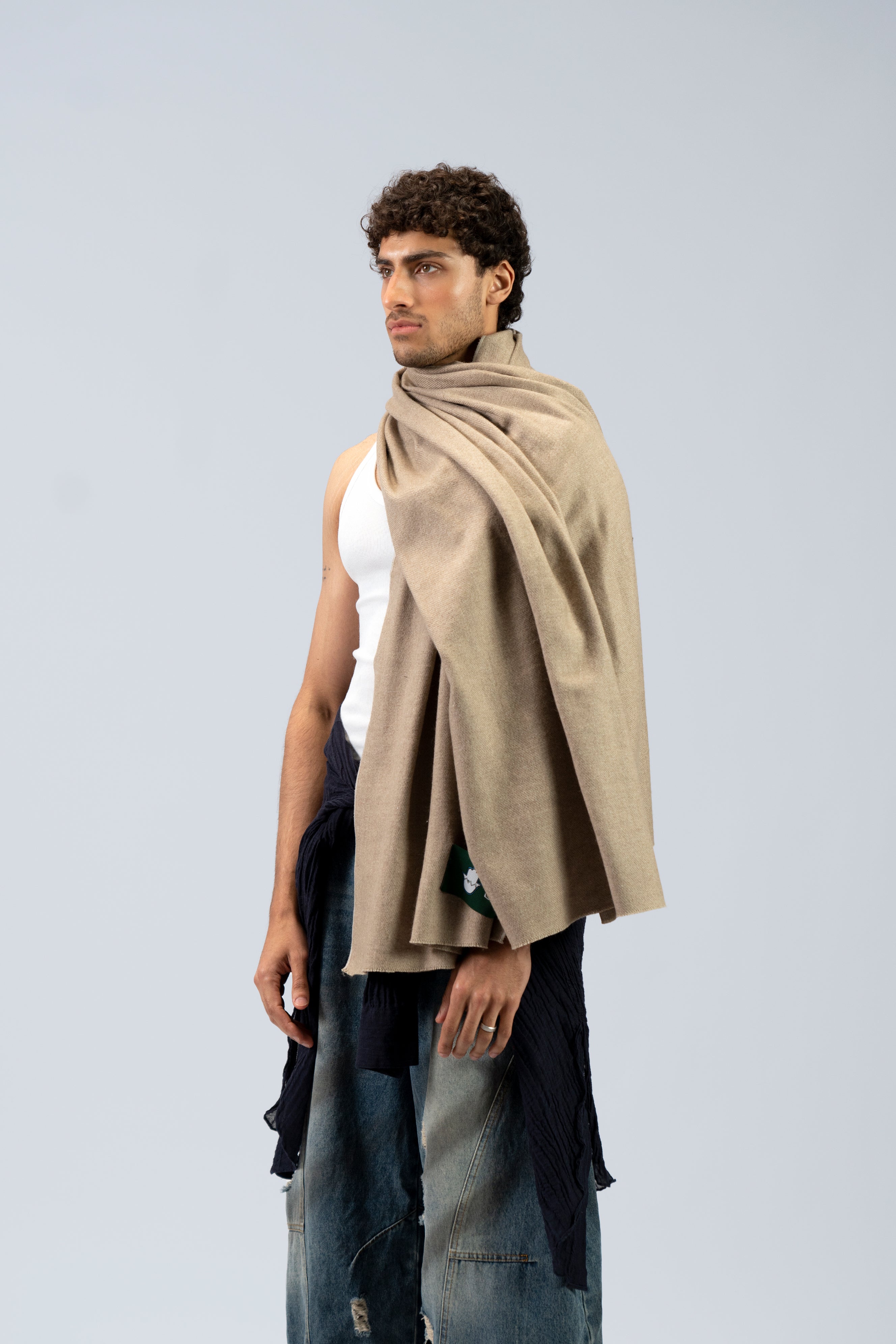 beige handwoven wool shawl worn by a woman, handwoven by SHAAL