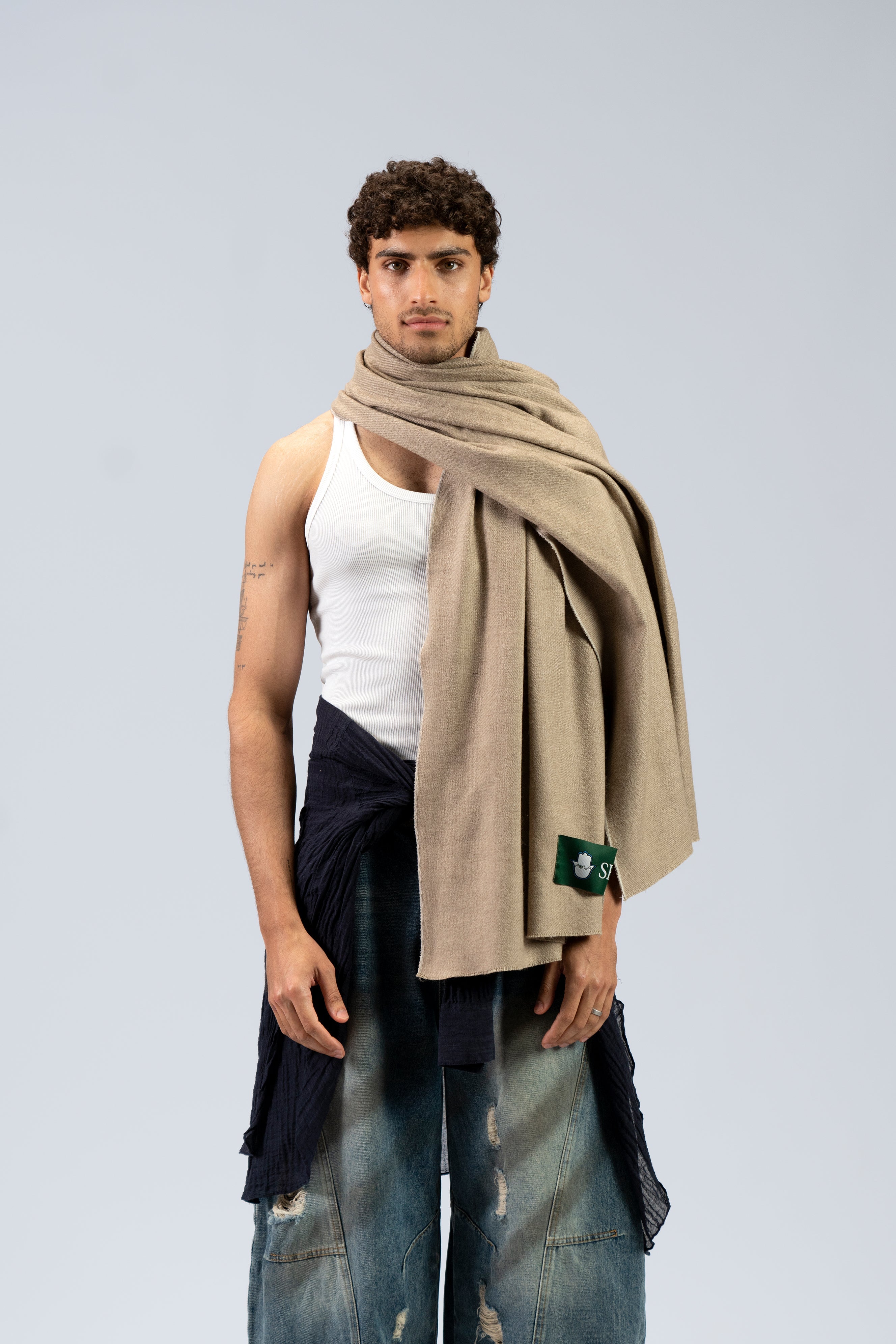 beige handwoven wool shawl worn by a woman, handwoven by SHAAL