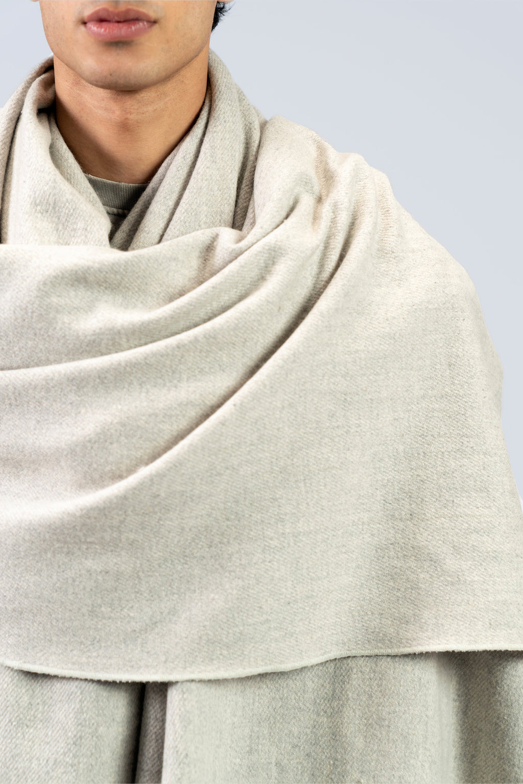silver handwoven wool shawl worn by a man, handwoven by SHAAL