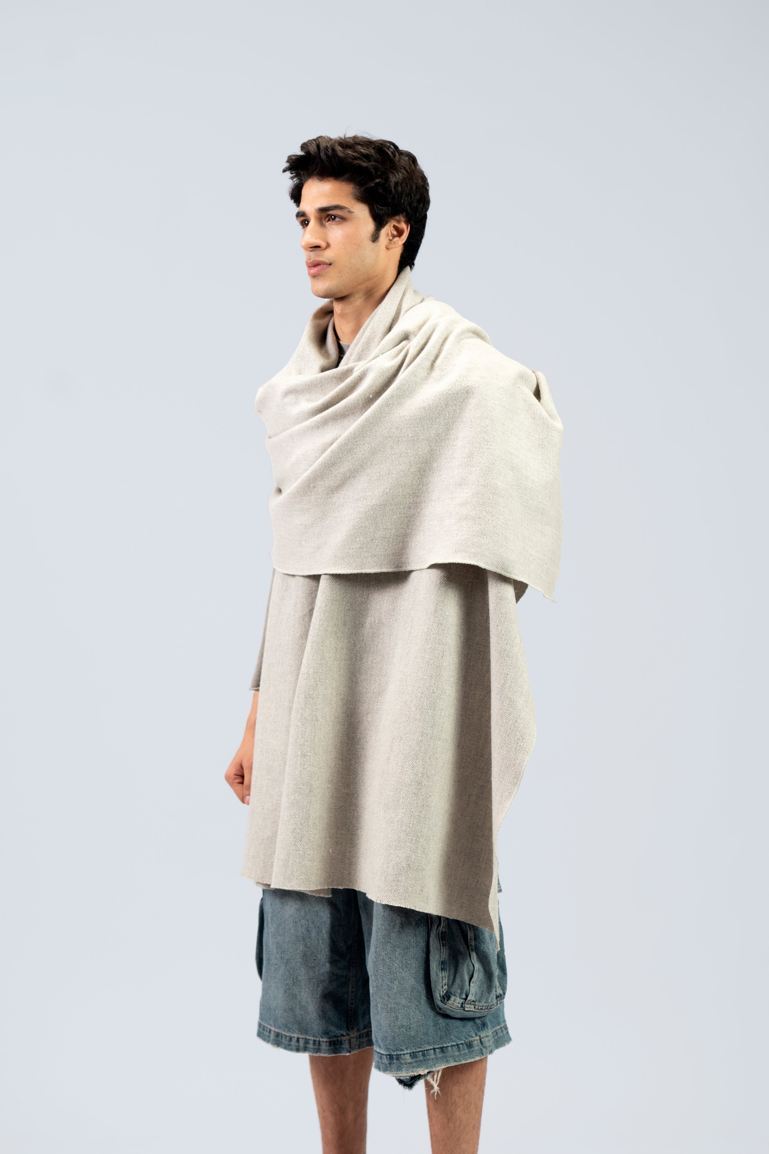 silver handwoven wool shawl worn by a man, handwoven by SHAAL