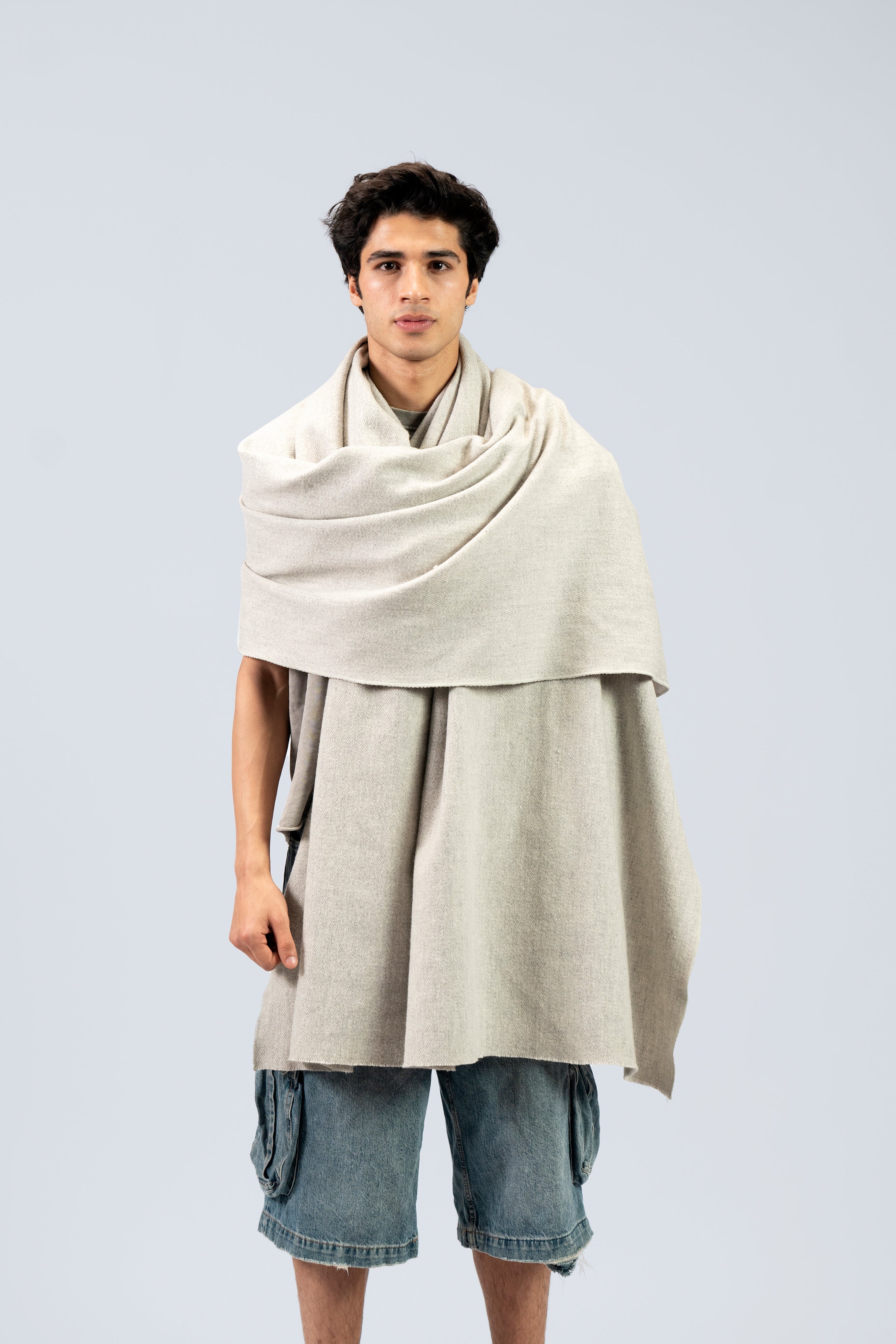 silver handwoven wool shawl worn by a man, handwoven by SHAAL