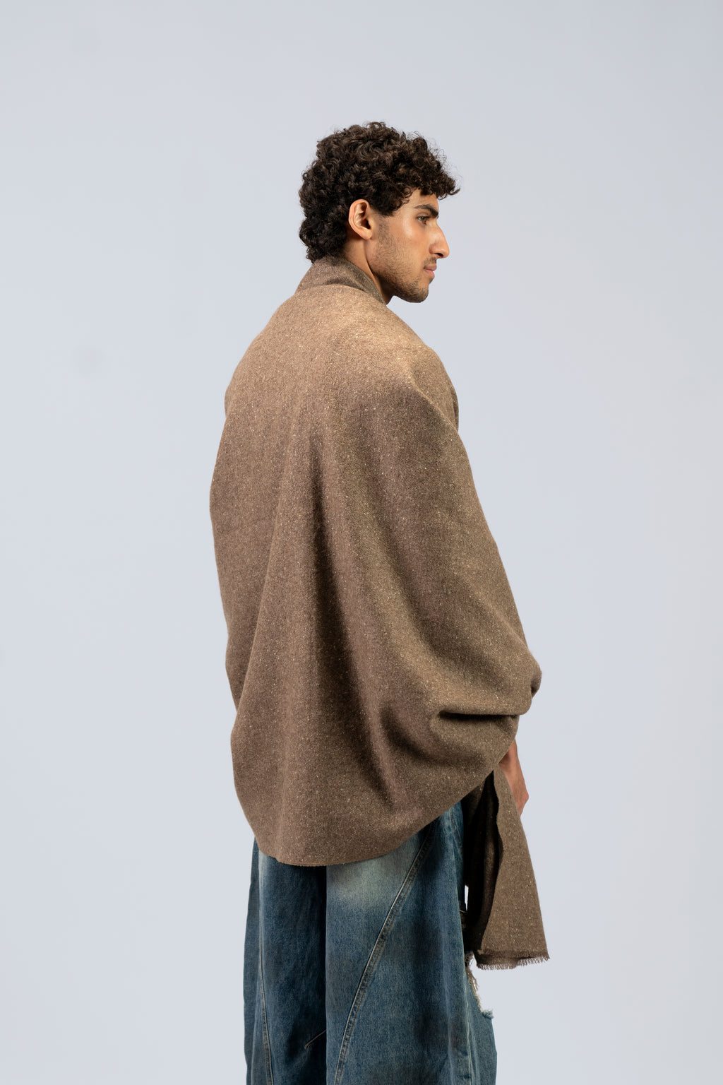 Brown yak wool shawl worn wrapped around neck and chest
