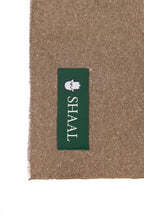 Brown yak wool shawl folded detail, showing fabric weight
