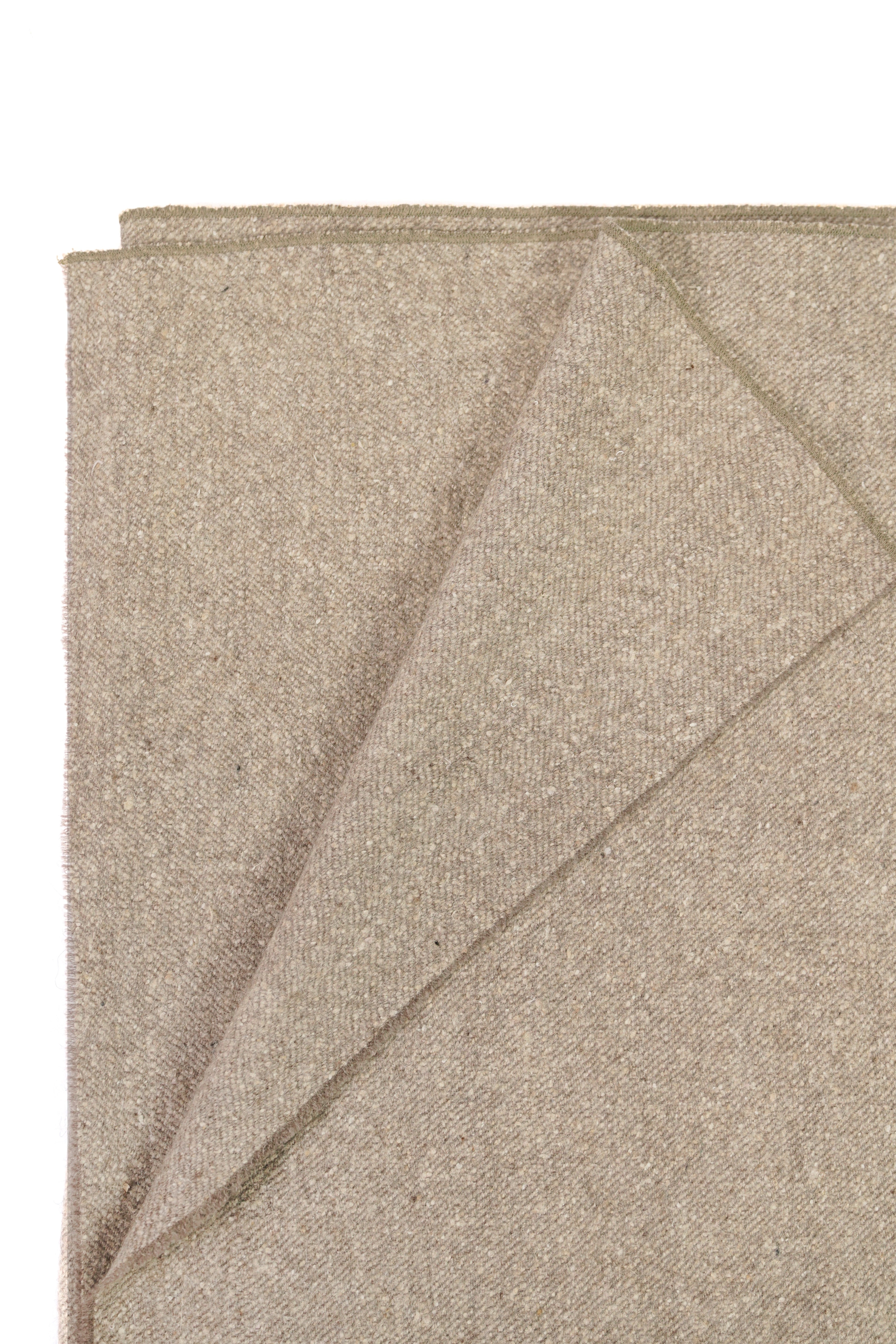 Folded Beige Shawl close-up on white background