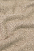 beige yak wool shawl worn by a woman, handwoven by SHAAL