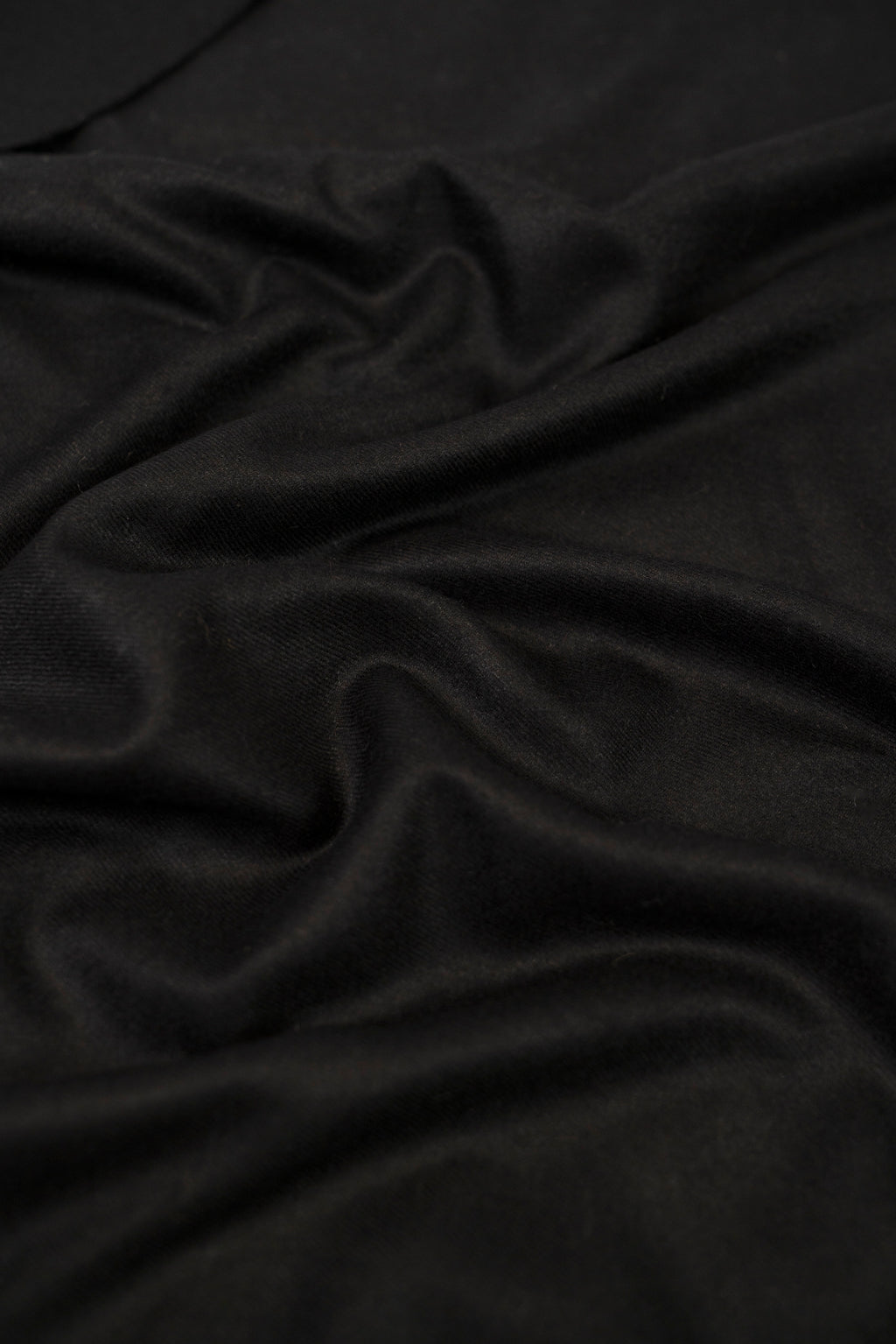 Black pashmina shawl close-up of soft cashmere-blend fabric weave