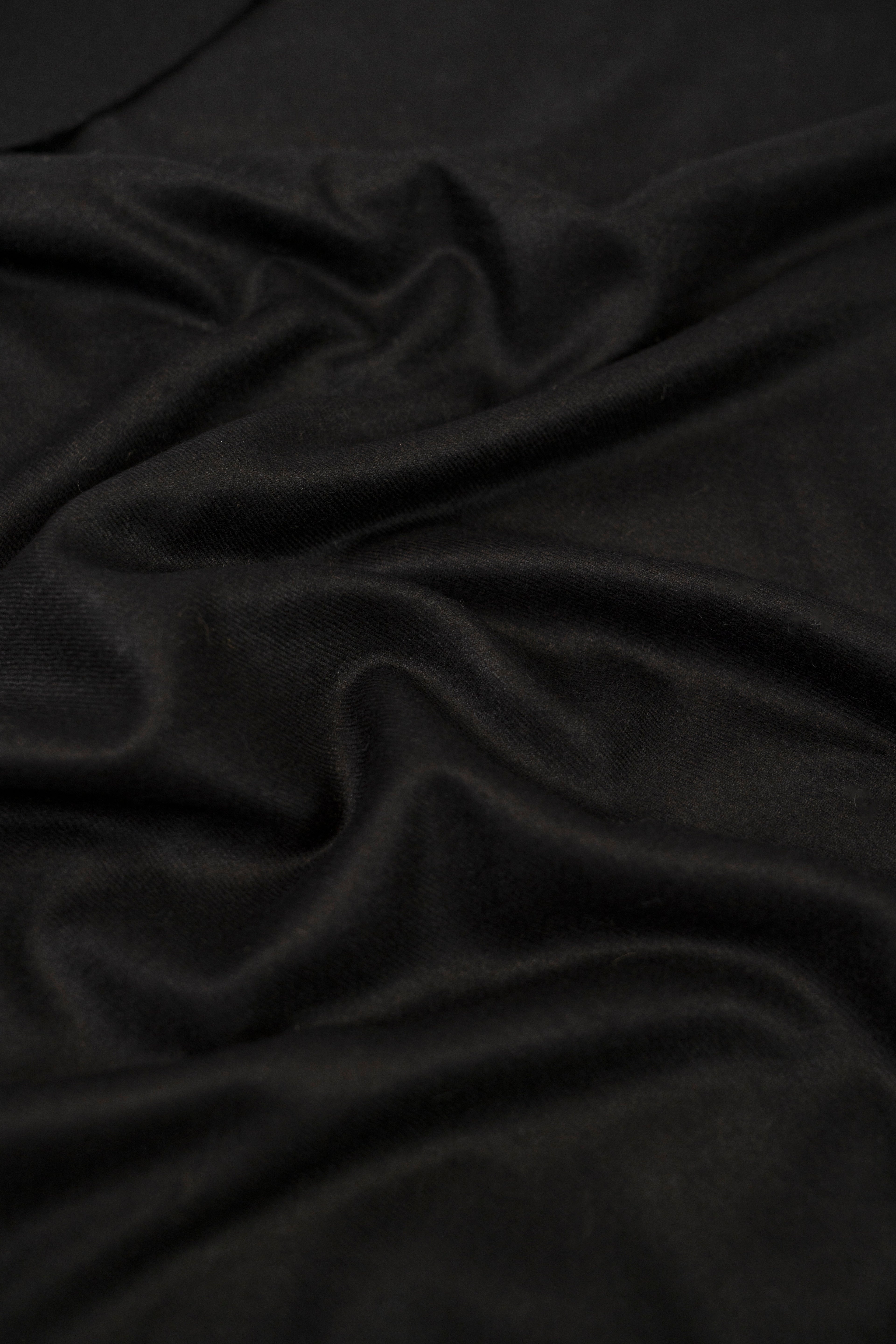 Black pashmina shawl close-up of soft cashmere-blend fabric weave