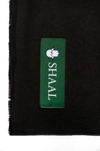 Black pashmina shawl detail of green SHAAL woven label