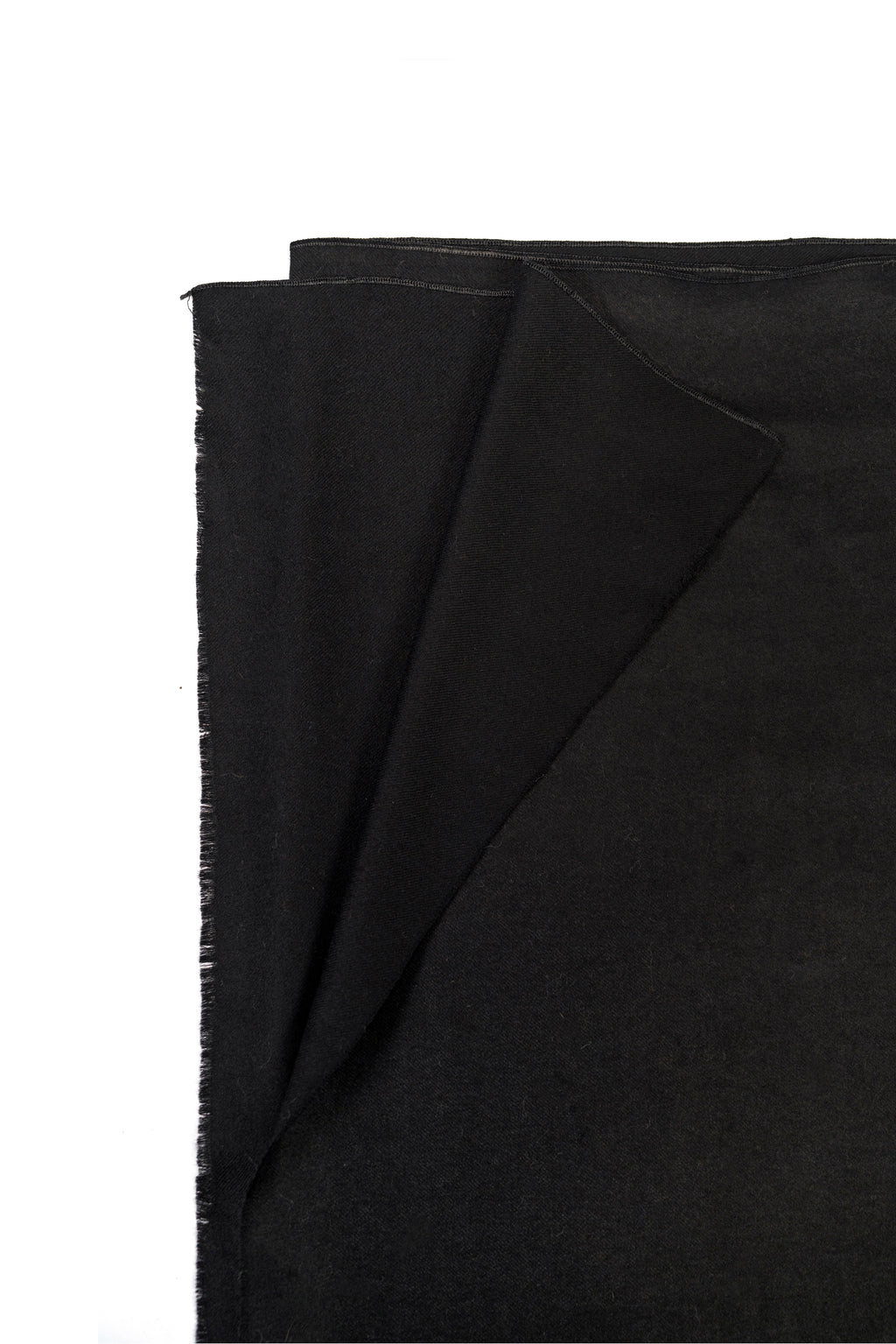 Black pashmina shawl folded corner on white background