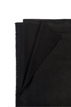 Black pashmina shawl folded corner on white background
